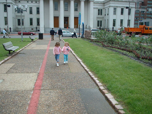 Alsatia and Savannah holding hands while navigating puddles.jpg 111.5K